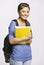 Student carrying backpack and notebook