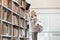 Student choosing book at university library