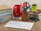 Student desktop, books,  accessories, stationery, mug, in the foreground mysterious envelope with the words