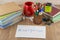 Student desktop, books,  accessories, stationery, mug, in the foreground mysterious envelope with the words