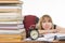 Student with despair looking at big stack of books