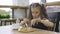 Student elementary school eating in the cafeteria alone.