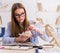 Student examining animal skeleton in classroom