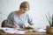 Student female performing a written task in a copybook