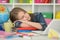 Student girl sleeping on books