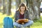 Student girl studying reading notes outdoors