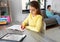 Student girl with tablet pc learning at home