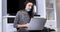 Student girl talking online at laptop during the coronavirus pandemic