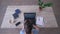 Student girl uses laptop while typing text on keyboard and writes notes in clipboard sitting at desk during e-learning