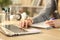 Student hands studying comparing notes with laptop