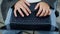 Student hands working keyboard outdoor closeup. Unknown man typing laptop device