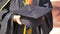Student hold hats in hand during commencement success on yellow background