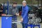 Student with instructor repairing car during apprenticeship