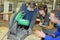 Student in ironworks class using circular saw