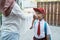 Student kiss his parent`s hand before going to school