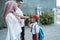 Student kiss his parent`s hand before going to school