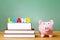 Student loan theme with textbooks and piggy bank