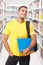 Student looking up look library books portrait format smiling happy young man people