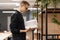 A student man picking books from the shelf