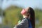 Student with mask breathing fresh air in a park