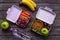 Student meal in purple lunch boxes filled with sandwich and fruits