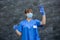 Student nurse holding insulin syringe with blood