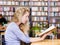 student reads the book in library