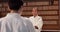 Student, sensei and aikido training with fitness, respect and exercise in gym. Teaching, learning and greeting, men in