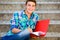 Student sitting on stairs