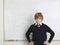 Student Standing By Whiteboard In Math Class