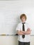 Student Standing By Whiteboard In Math Class