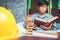 A student of structural engineer reading a book of university.