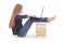 Student teenage girl sitting sideways on the book with laptop