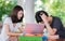 Student tutor teach her friend before examinatuin in out door li