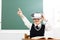 Student with virtual reality headset sitting in classroom