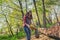 Student volunteer helps in cleaning the Park area. The girl puts a plastic bottle in a garbage bag