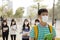 student wearing mouth mask against smog in city