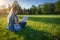 Student woman online business with laptop, computer tablet in summer park. Girl person work nature outdoor. People