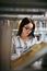 Student Woman Searching Books In Bookstore Or Library