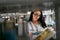 Student Woman Searching Books In Bookstore Or Library