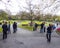 Students, businessmen and tourists stroll and chat in Phoenix Park in Dublin on a bright spring afternoon