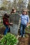 Students caring for the grave of a deceased headmaster in the Kaluga region of Russia.