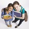 Students carrying book bag, backpack and notebooks