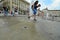 Students celebrating the last school day taking ritual shower in downtown fountain