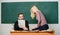 Students in classroom chalkboard background. Education concept. College entrance exam. Prepare final exam. Students