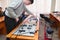 Students connect wires control panel with small test bench for experiments