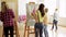 Students with easels painting at art school