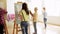 Students with easels painting at art school