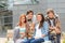 Students friends sitting bench outside campus