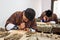 Students learning wood carving at art school